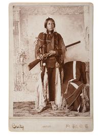 [NATIVE AMERICANS] BRETZ, George. Cabinet card of armed Comanche Indian. Ft. Sill, Oklahoma Terr.