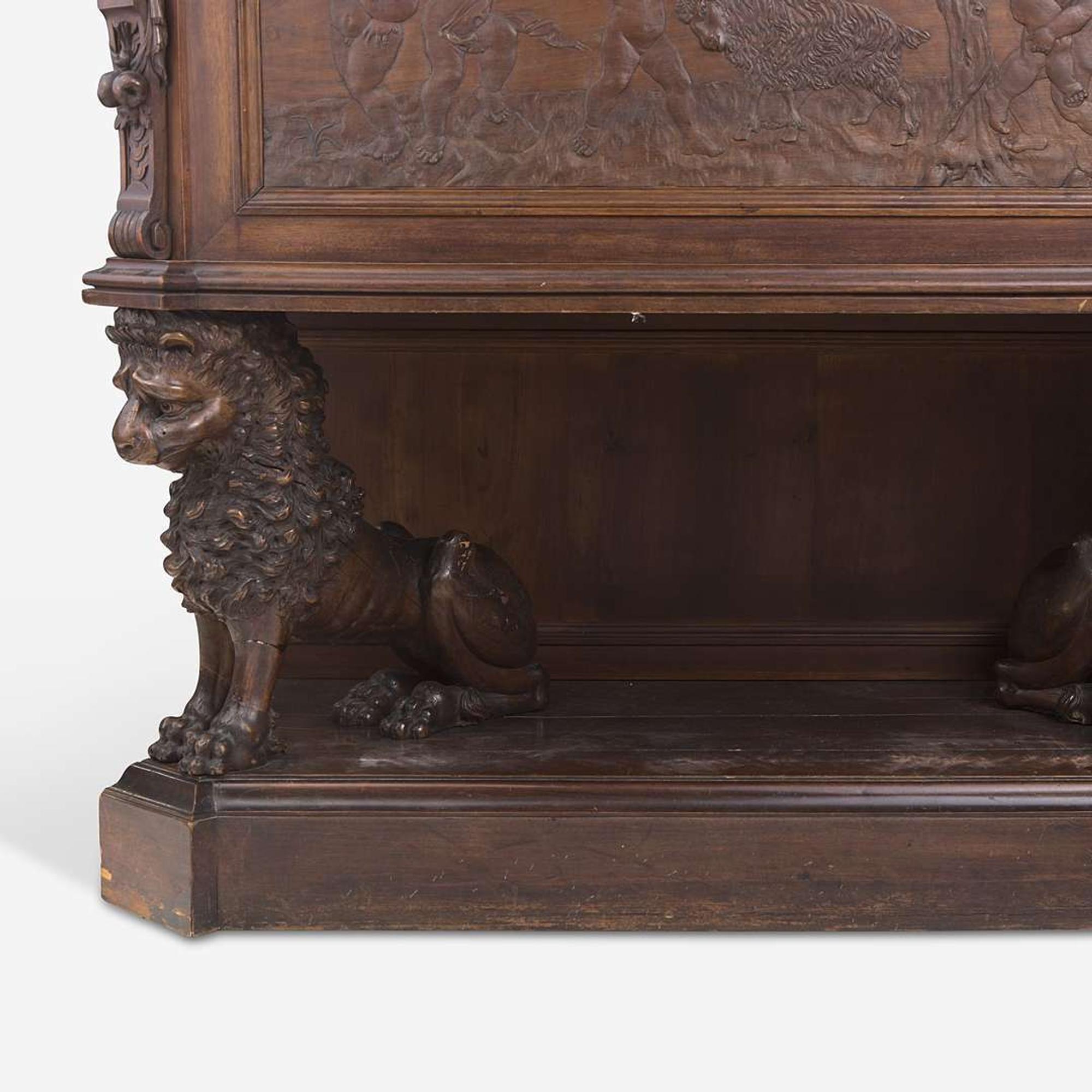 A Renaissance Revival Carved Walnut Chest on Stand Italian, 19th century