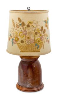 A Brown Glazed Stoneware Crock with a Later Crewel Work Shade