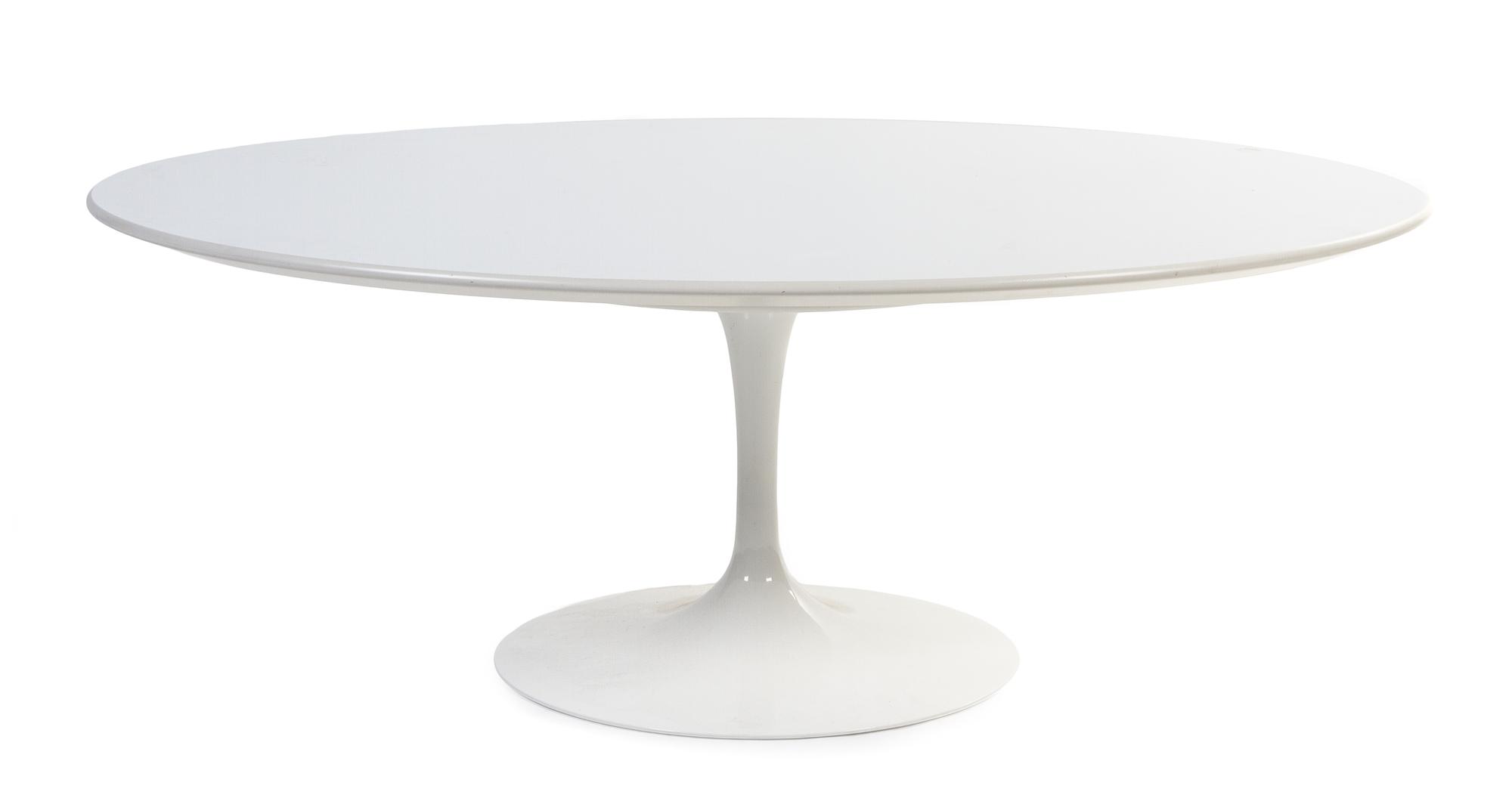 An Eero Saarinen Tulip Low Table Height 16 x length 42 x width 27 1/2 inches.