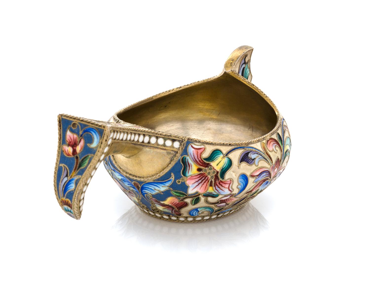 A Russian Enameled Silver Kovsh, Maker's mark obscured, Moscow, late 19th/early 20th century, the case having a beige ground with polyc