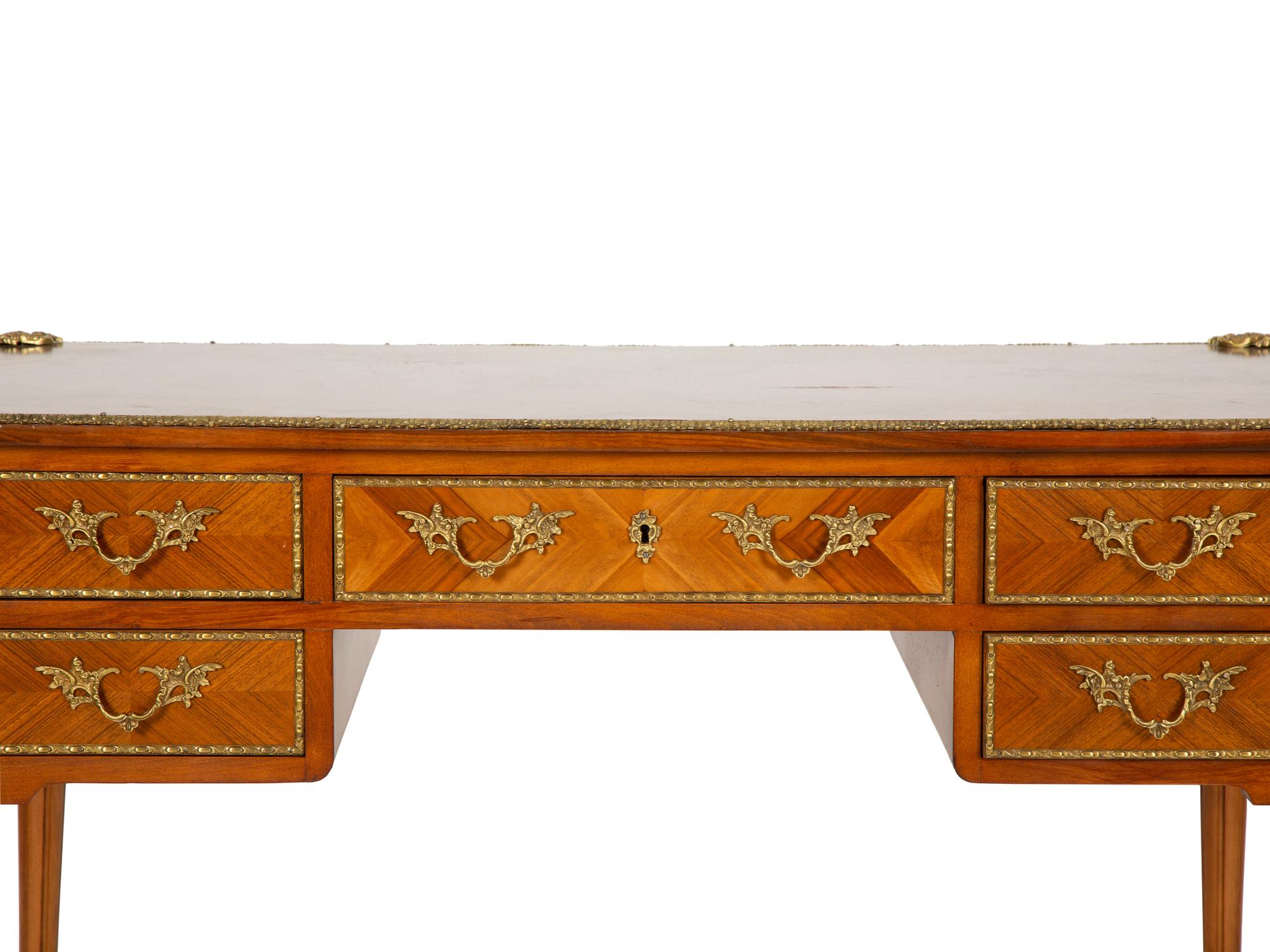 A Louis XVI Style Gilt-Bronze Mounted Mahogany Bureau Plat