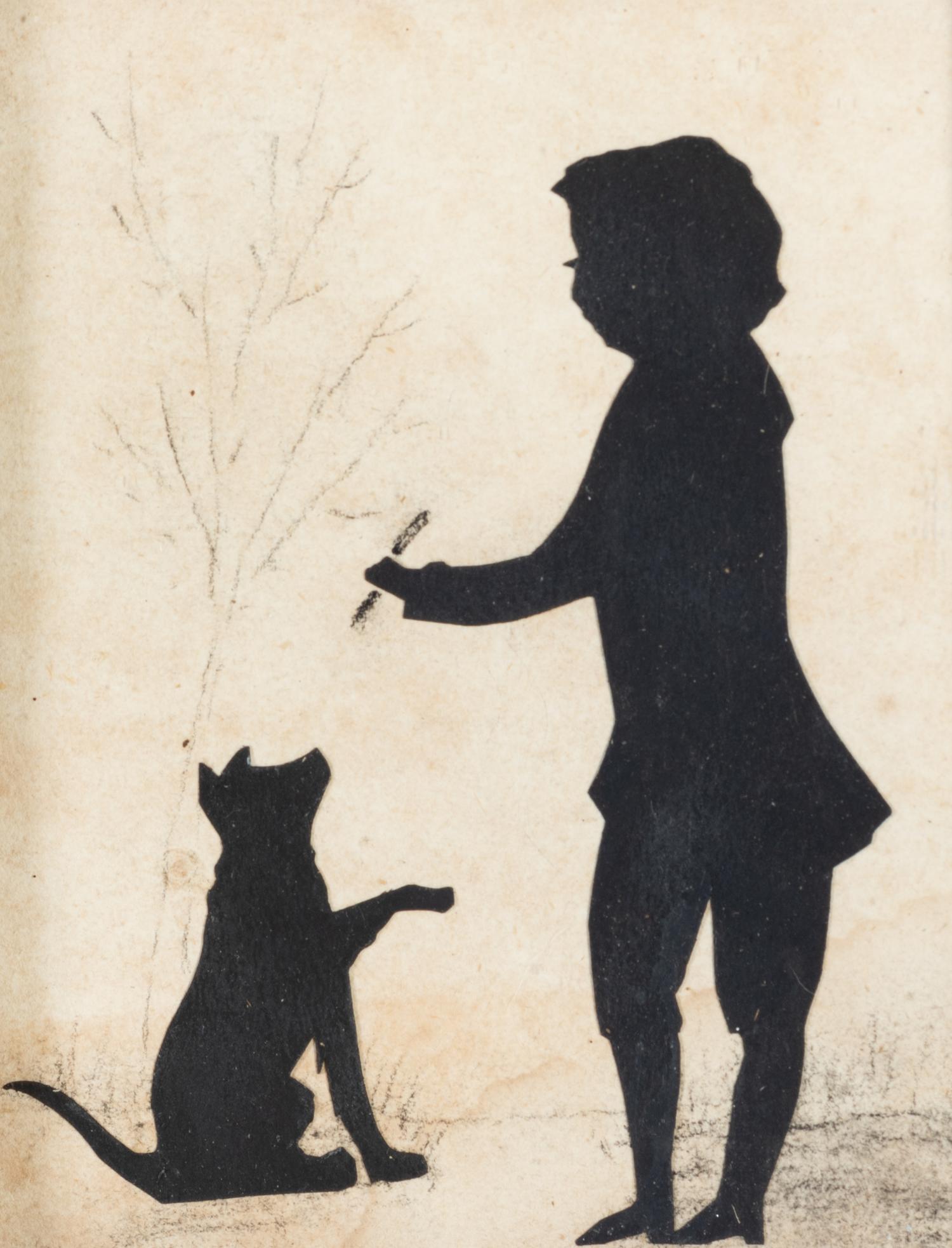 A Cut-Paper Silhouette of a Boy and Dog
