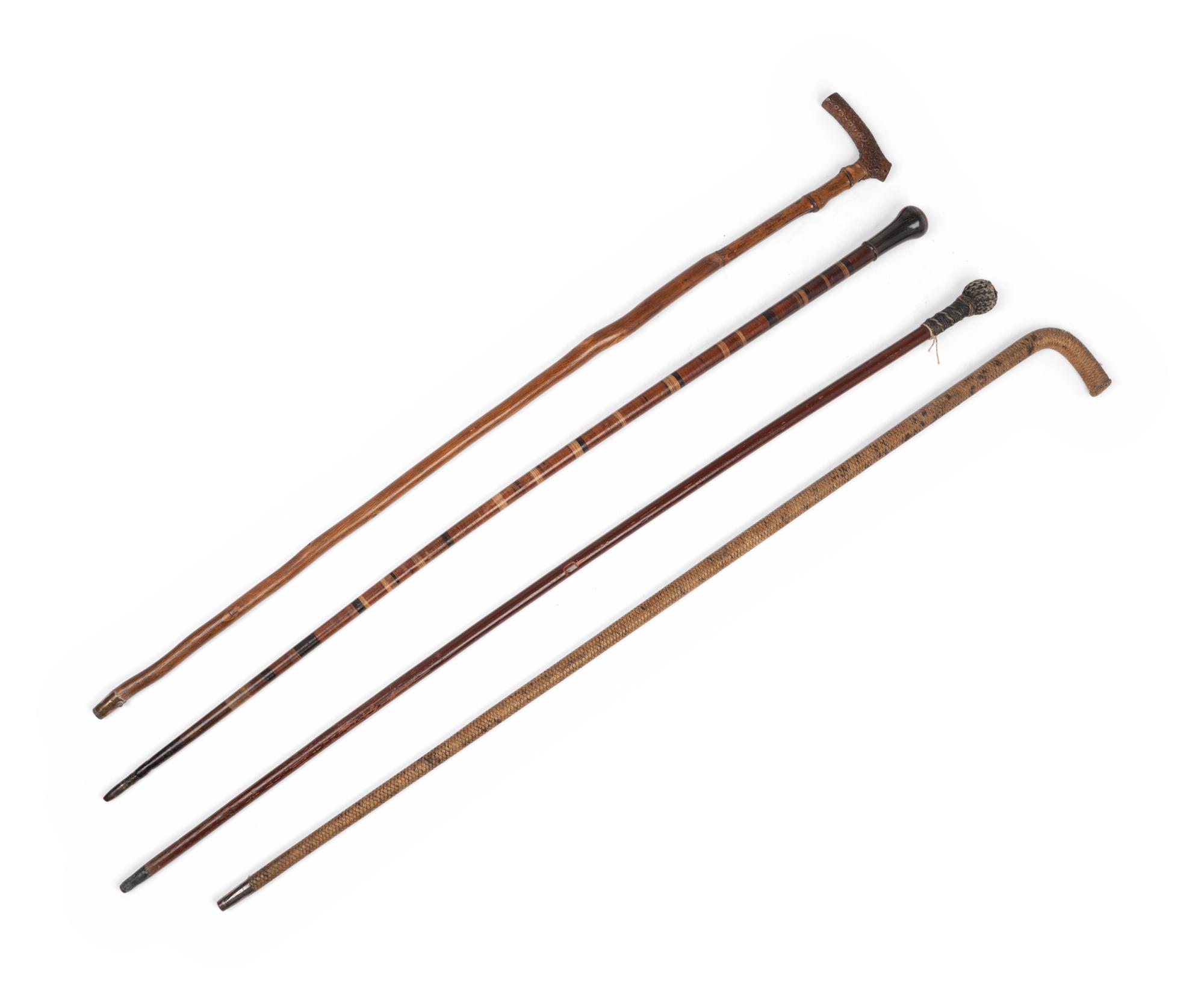 [COMBINED WITH ITEM 2] Four Carved Wood Walking Sticks