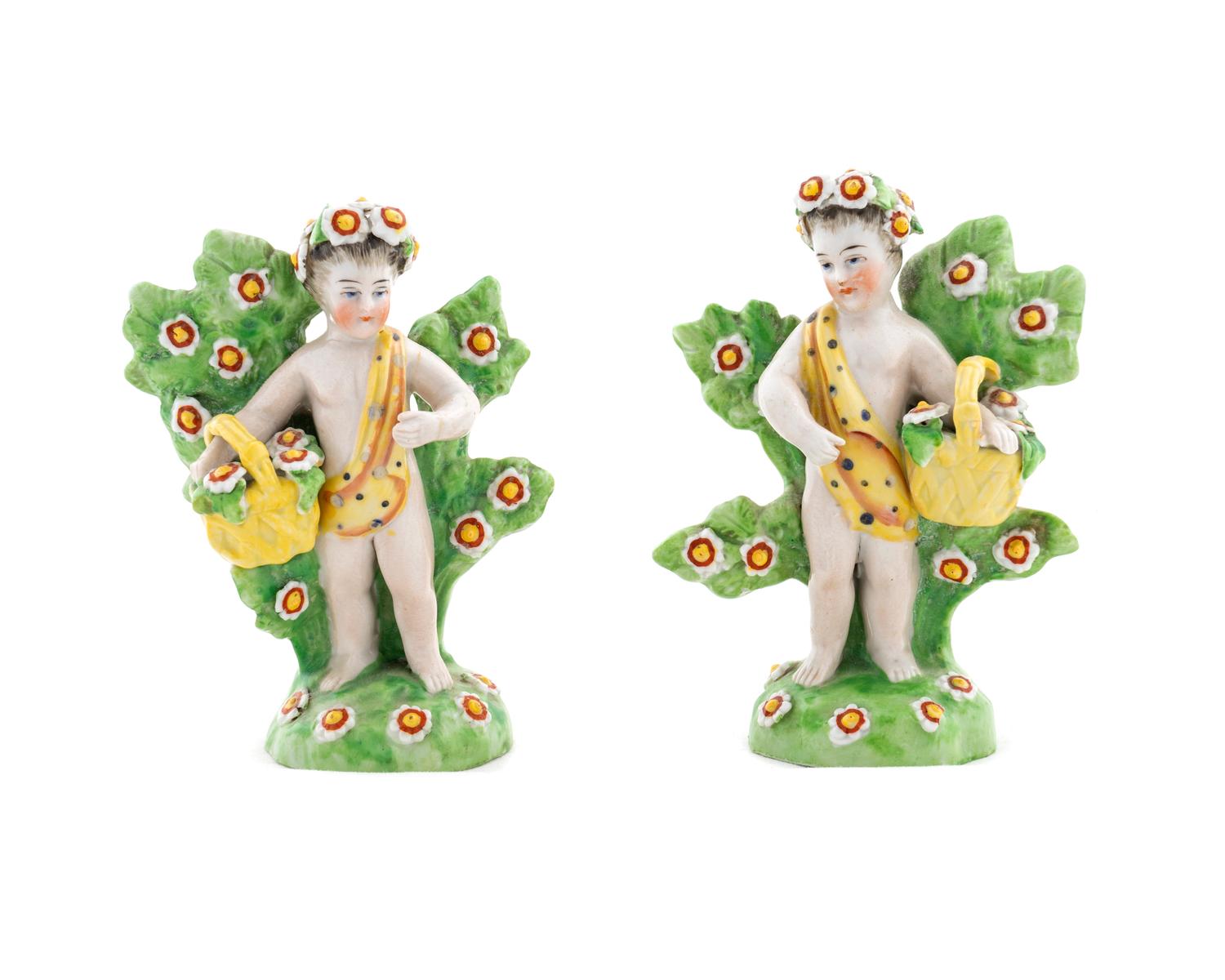 A Pair of Chelsea Derby Porcelain Figures of Putti — 19TH CENTURY