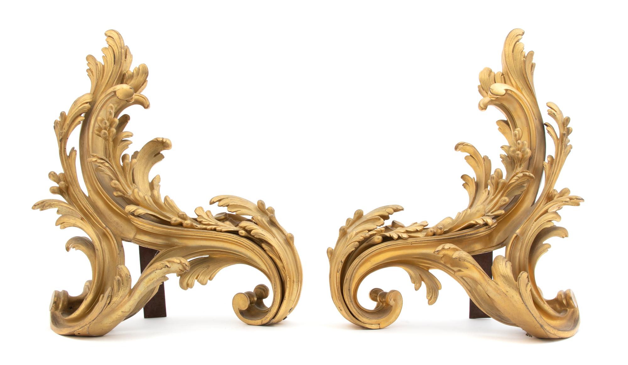 A Pair of Louis XV Style Gilt Bronze Scroll-form Chenets Height 15 x width 12 inches. — 19TH CENTURY