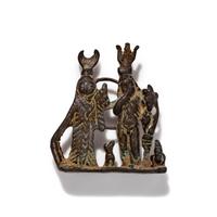 An Egyptian Silver Pendant with the Gods Isis and Harpocrates