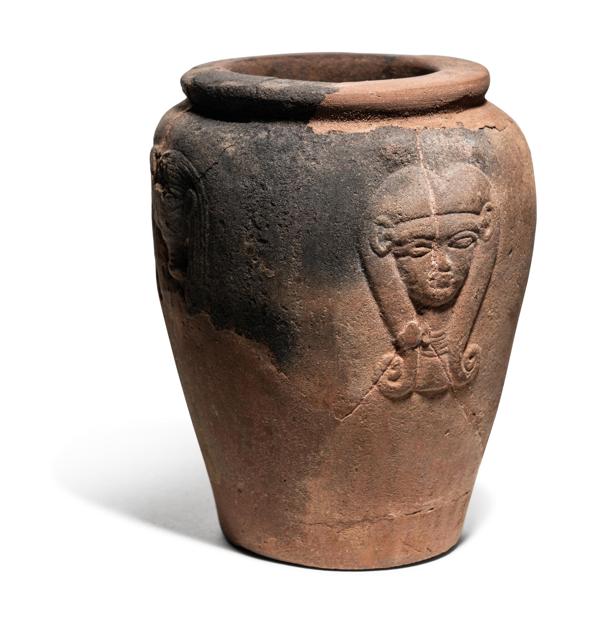An Egyptian Pottery Jar with Head of Hathor