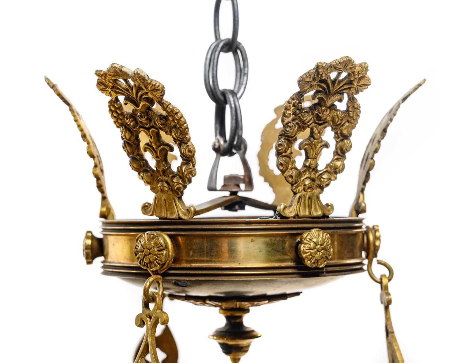 An Empire Style Gilt Bronze and Tôle Six-Light Chandelier