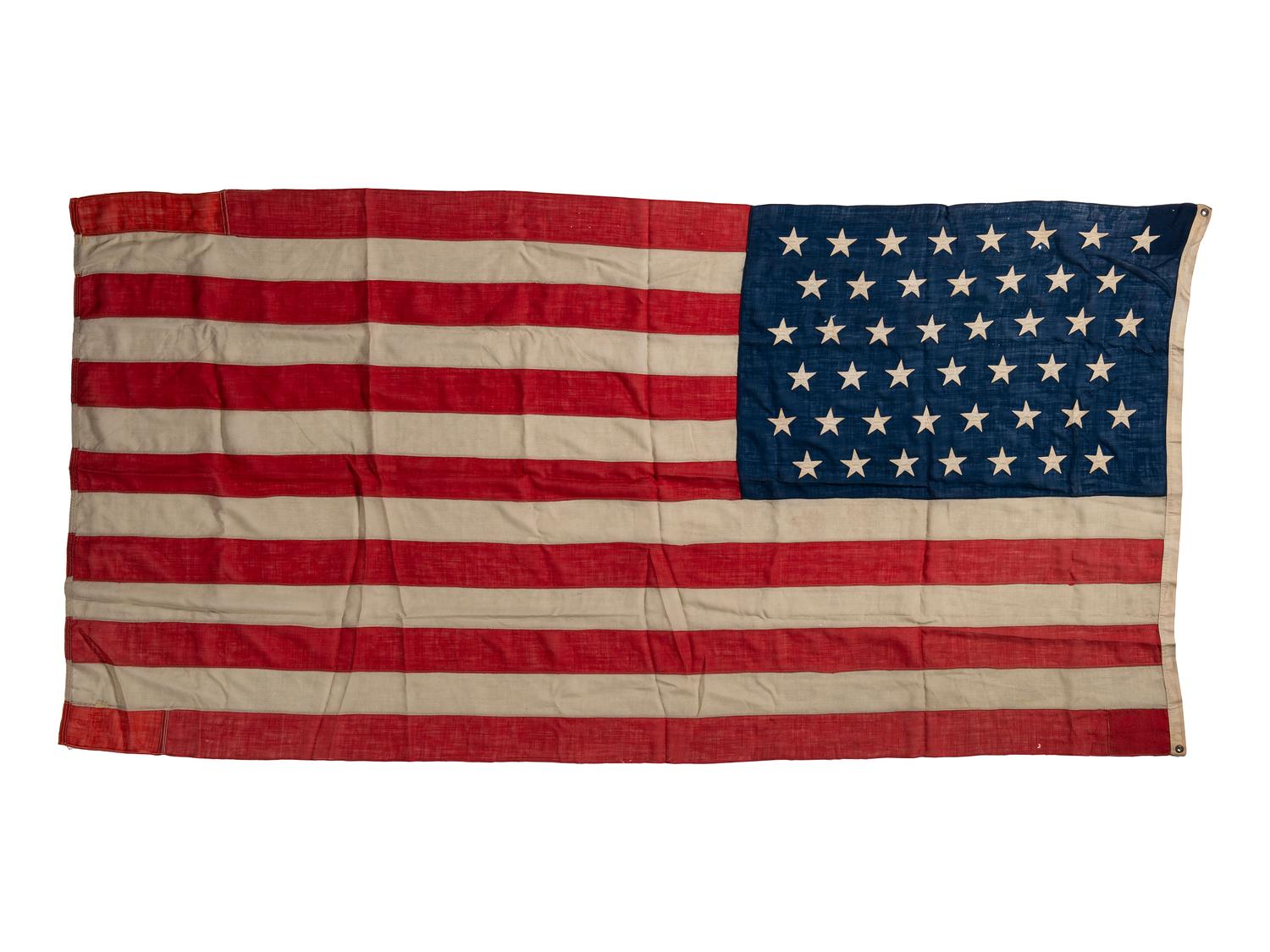 [CIVIL WAR]. A group of 2 American flags, incl. 44-star flag identified to “Camp 6 SoV ILL DIV USA” (Sons of Veterans, Illinois Division USA). [Ca 1891-1896].