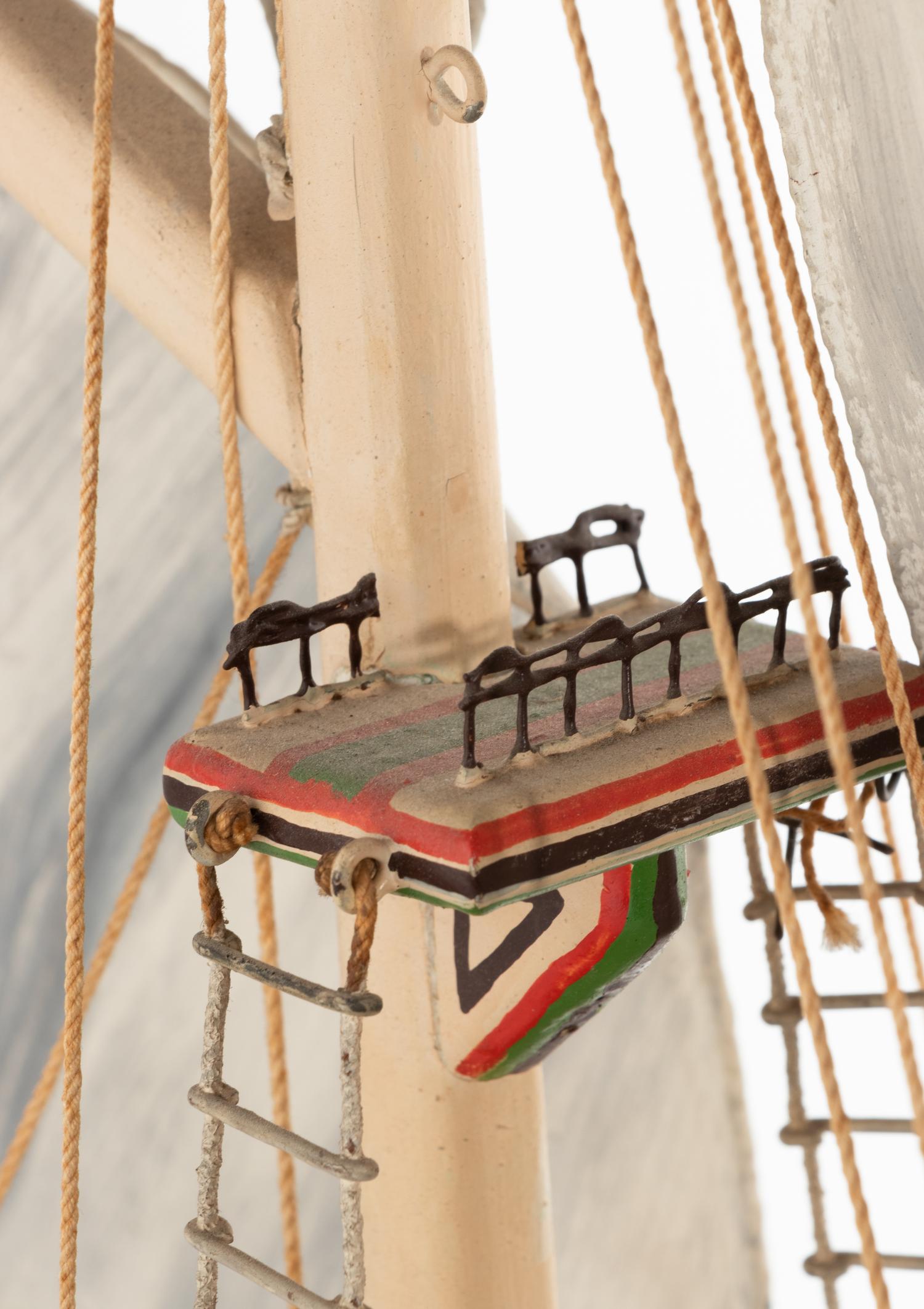 A Carved and Polychrome Painted Wooden Ship Model