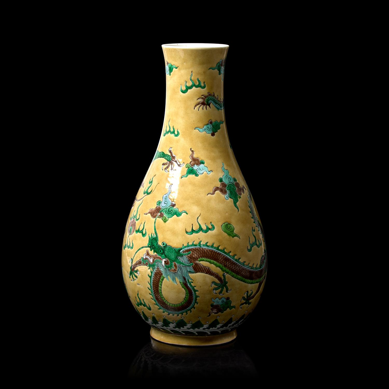 A Chinese Yellow Ground Famille Verte 'Dragons' Vase, Late Qing to Republic Period 晚清-民國 黃地素三彩龍紋瓶