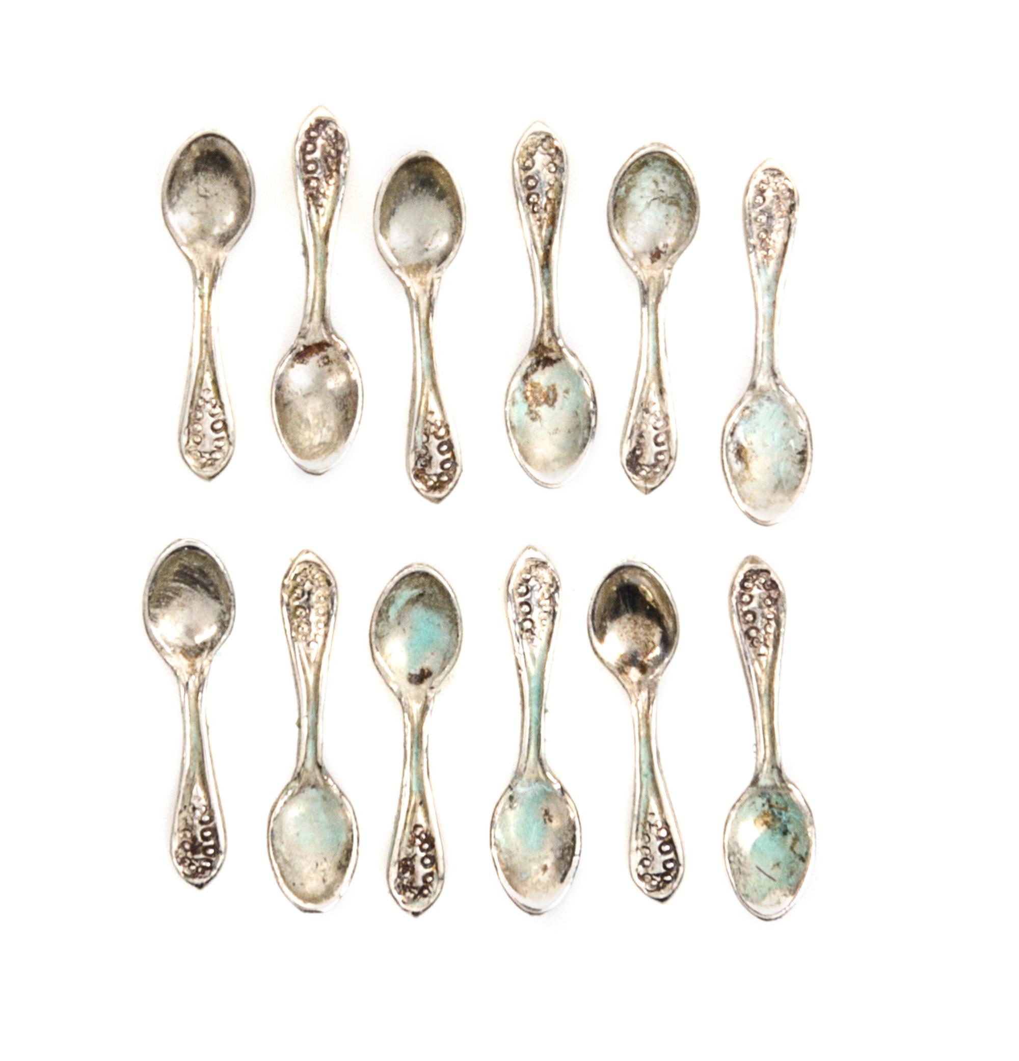 A Set of Twelve American Silver Teaspoons, Attributed to Obadiah Fisher, New York, NY, each having Old English handles with beaded deco