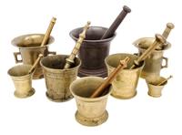 A Collection of Brass and Mixed Metal Mortar and Pestles Height of tallest mortar 6 inches.