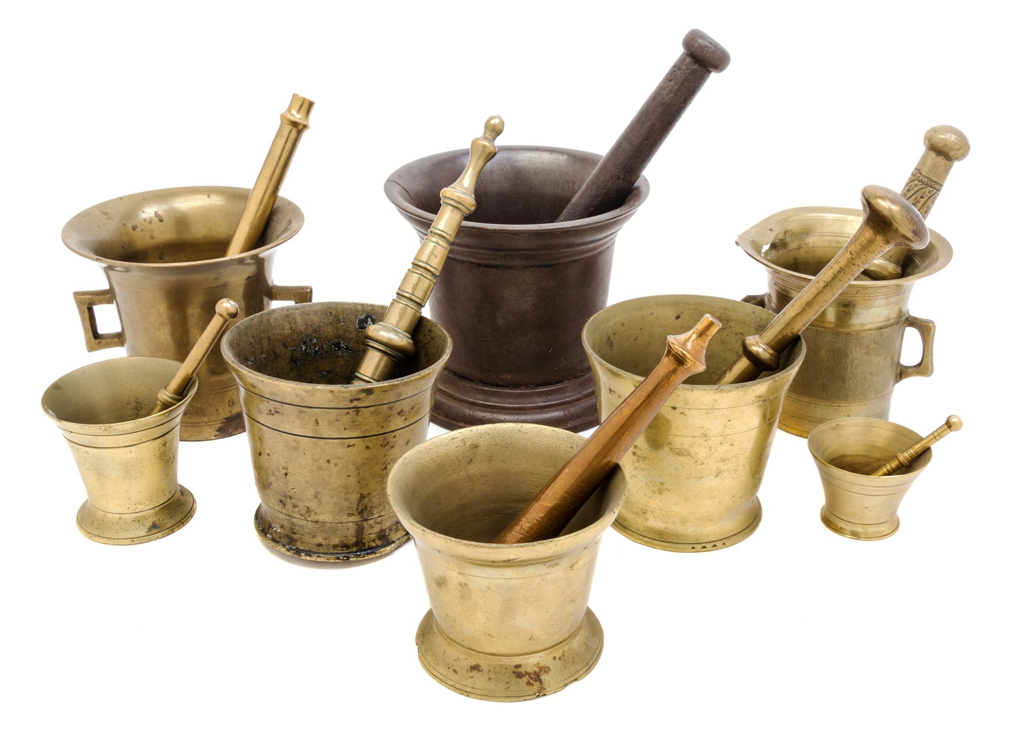 A Collection of Brass and Mixed Metal Mortar and Pestles Height of tallest mortar 6 inches.