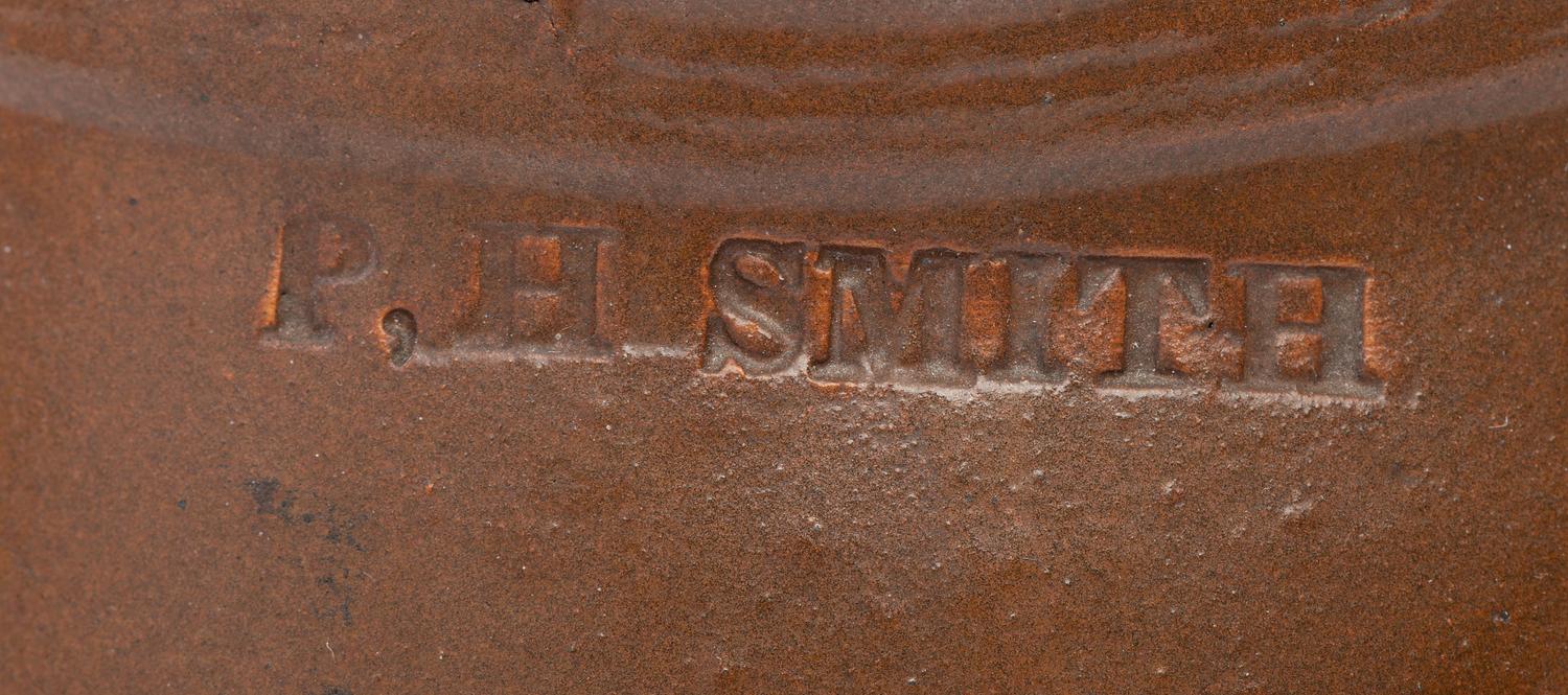 A P.H. Smith Albany Slip Stoneware Pitcher