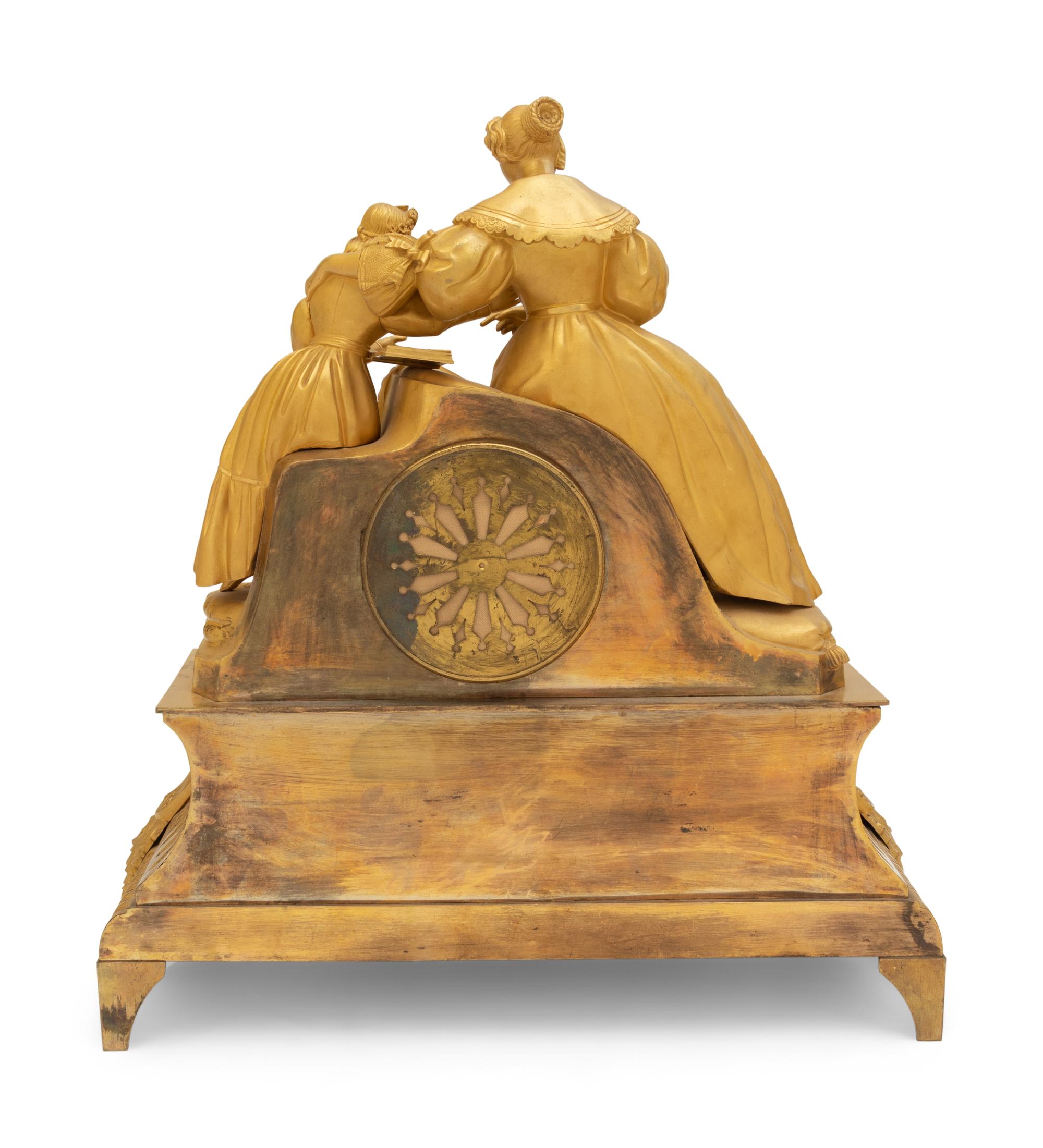 A Louis Philippe Gilt Bronze Figural Mantel Clock