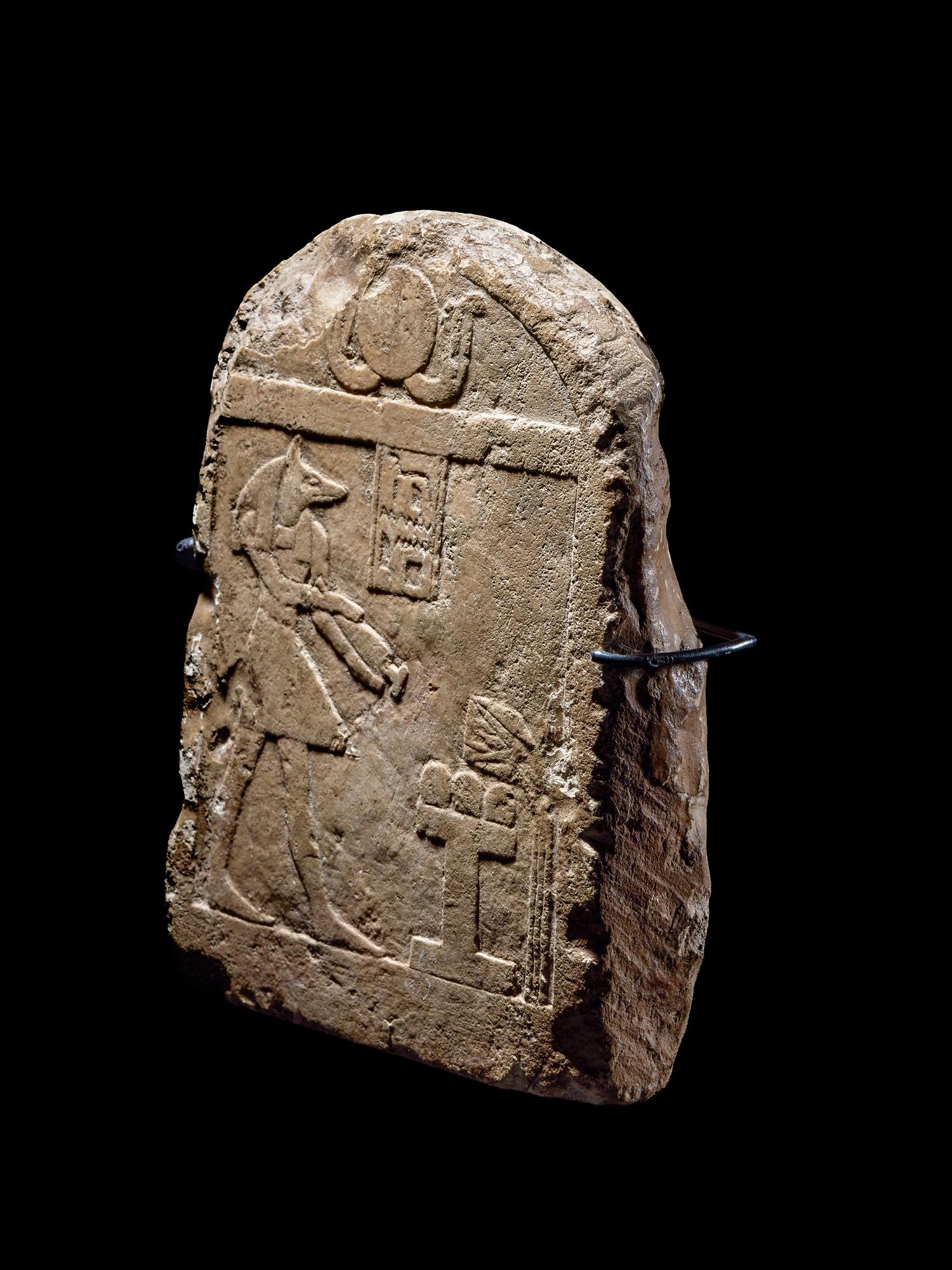An Egyptian Limestone Round-Top Stele