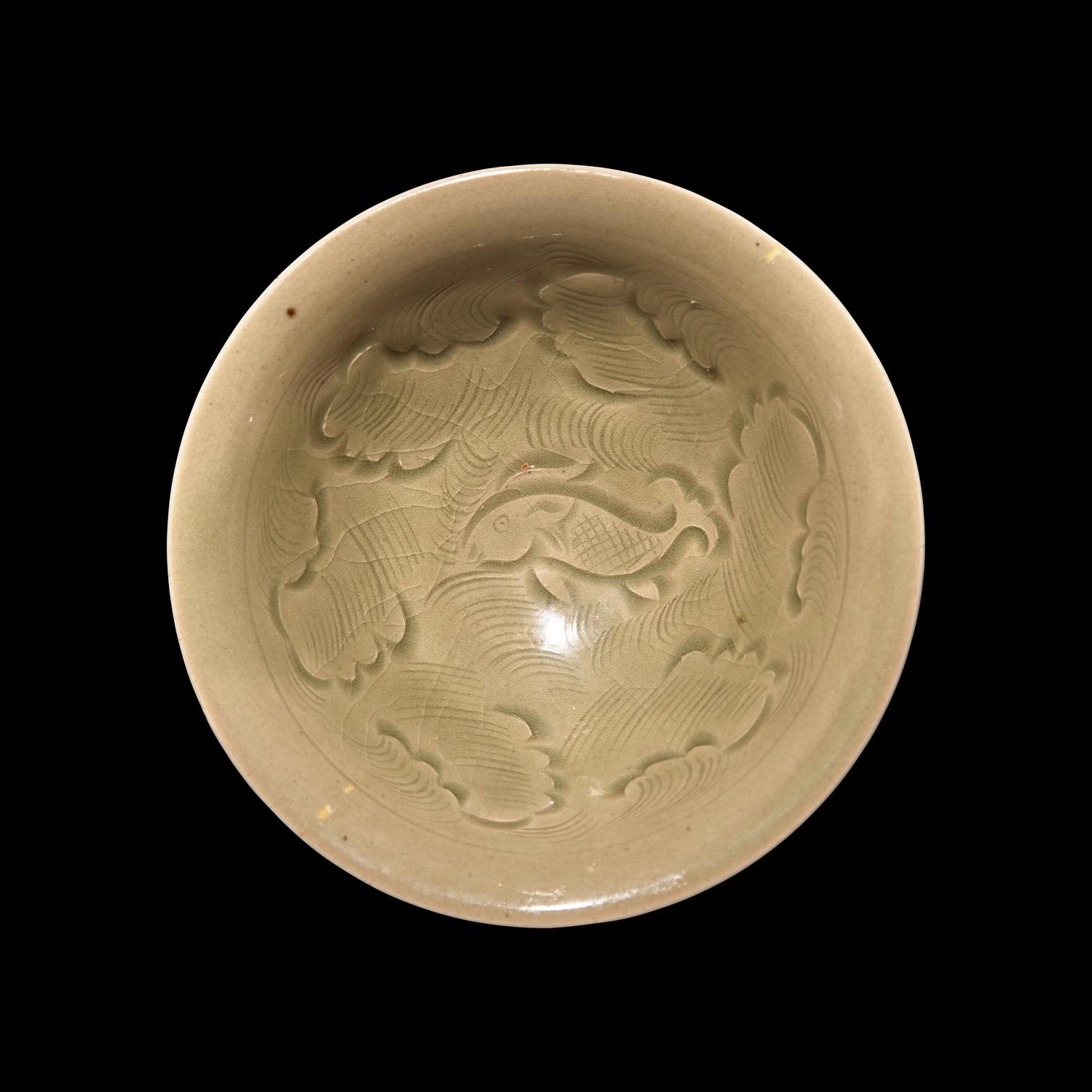 A Chinese Yaozhou Celadon 'Fish' Bowl, Northern Song Dynasty 北宋 耀州窯刻划花魚紋碗