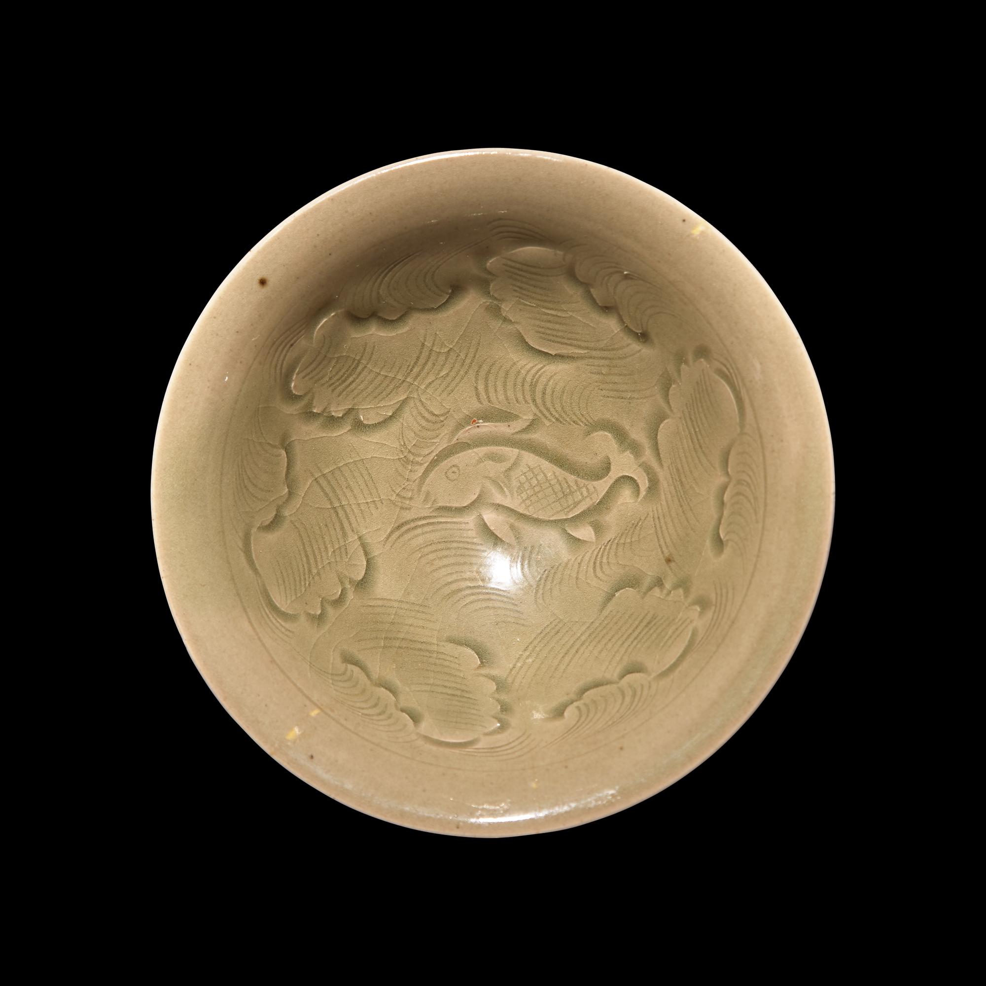 A Chinese Yaozhou Celadon 'Fish' Bowl, Northern Song Dynasty 北宋 耀州窯刻划花魚紋碗