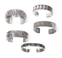 Five Southwestern Silver Bracelets Length of first 5 7/8 x opening 3/4 x width 3/8 inches