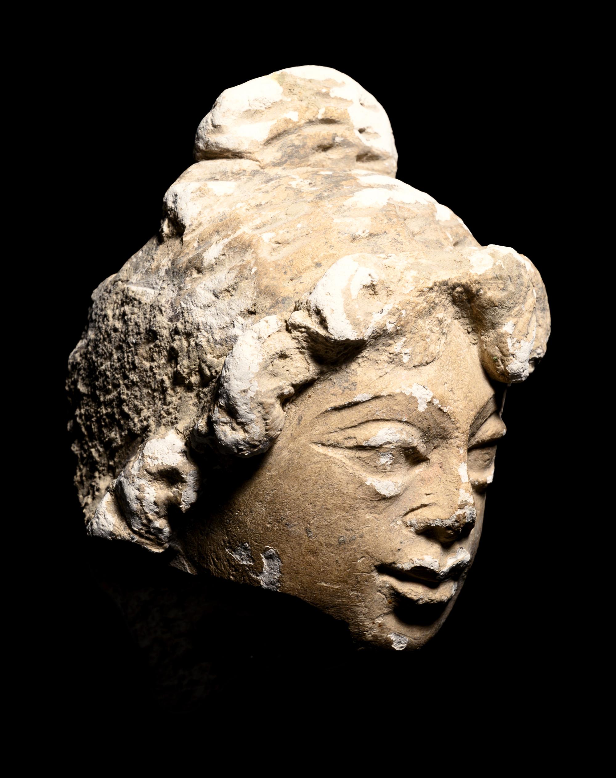 Three Gandharan Fragmentary Stucco Heads and One European Fragmentary Stucco Head