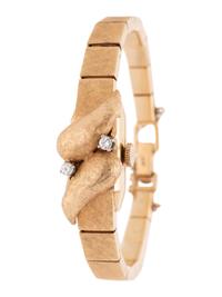 SOLD: 14K YELLOW GOLD AND DIAMOND SURPRISE WRISTWATCH