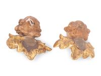 A Pair of Continental Painted and Parcel Gilt Putto Masks