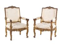 A Pair of Régence Style Carved Giltwood Fauteuils