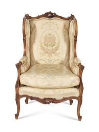 A Louis XV Style Carved Walnut Bergere