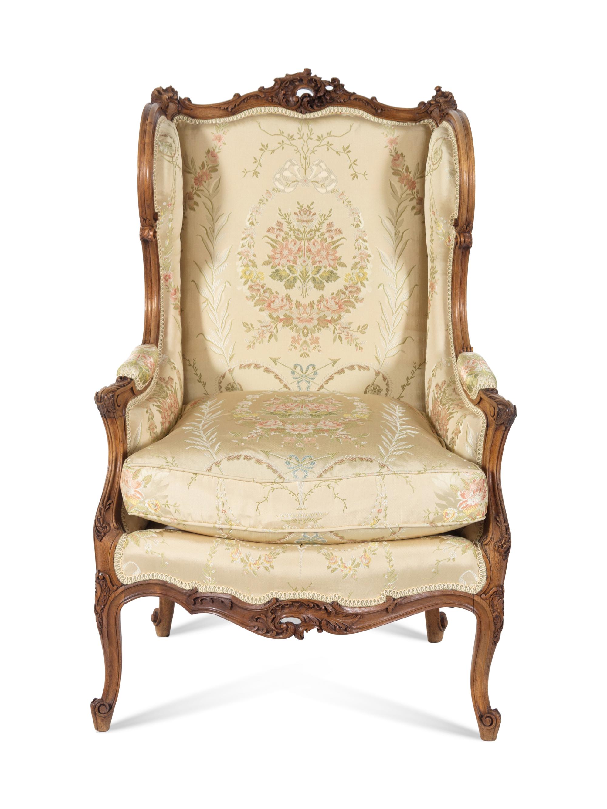 A Louis XV Style Carved Walnut Bergere