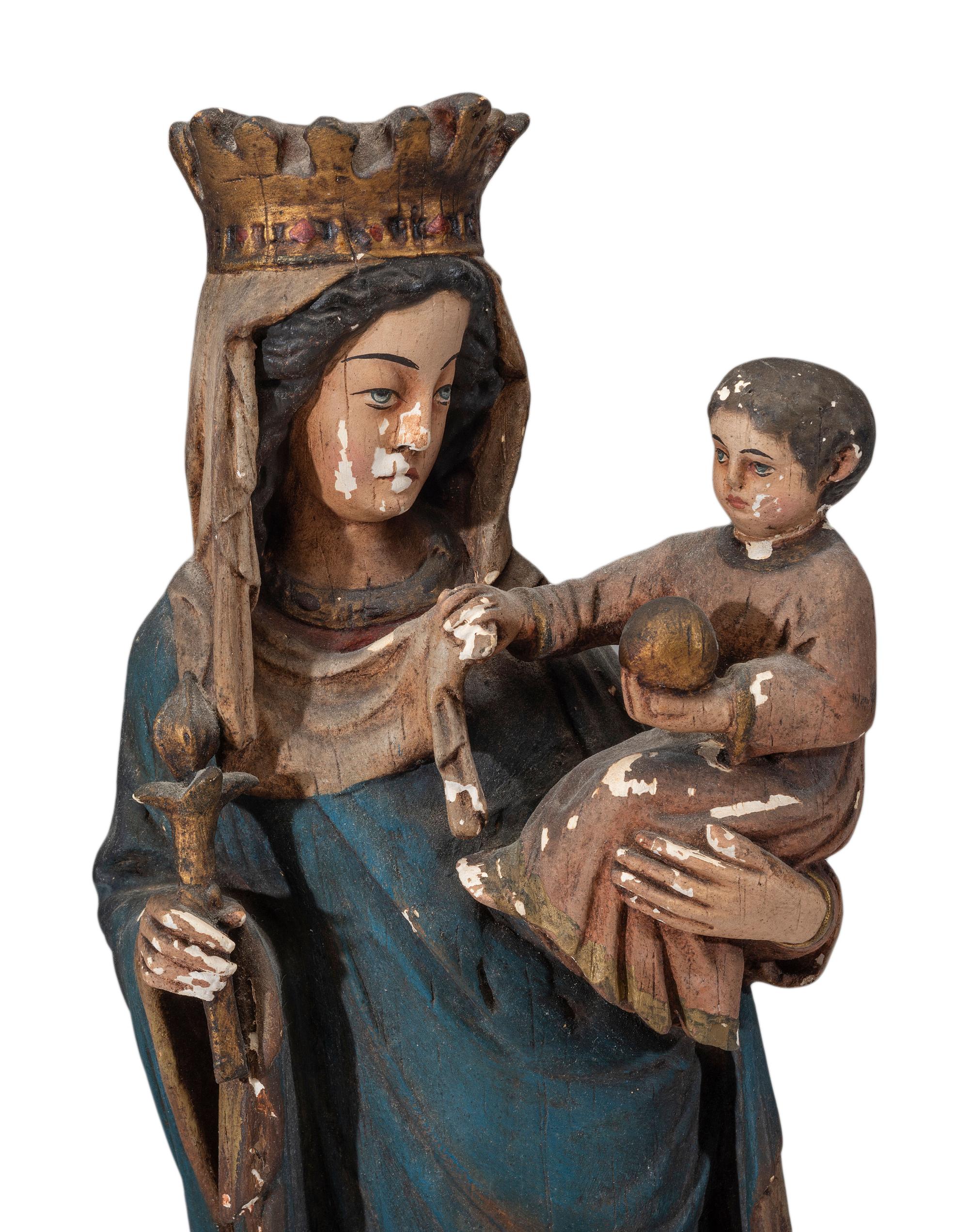 A Continental Paint Decorated Chalkware Santos Figure of the Madonna and Child