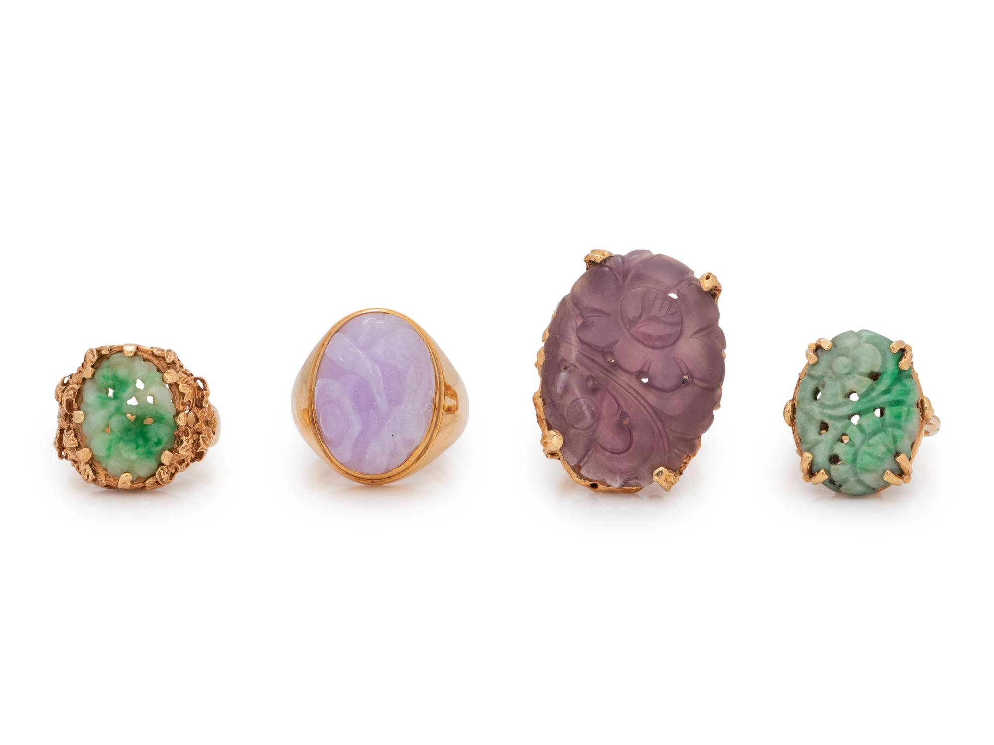 A Collection of 14 Karat Yellow Gold and Carved Hardstone Rings,