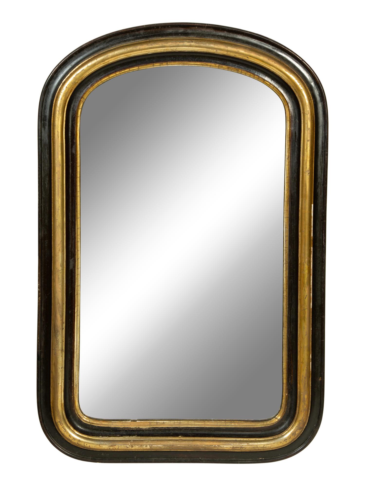 A Victorian Ebonized and Parcel Gilt Mirror