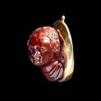 A Roman Carnelian Cameo of a Boy — Set in a gold pendant
