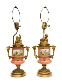 A Pair of Gilt Bronze Mounted Sèvres Style Porcelain Urns Mounted as Lamps