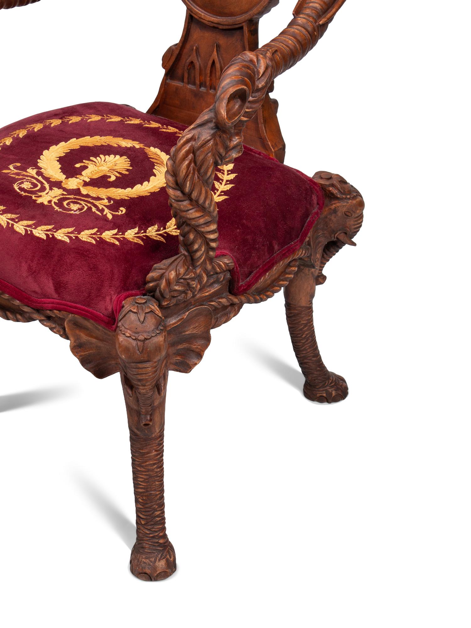 A Set of Four Carved Walnut Elephant Motif Fantasy Chairs