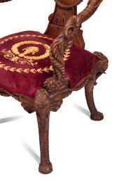 A Set of Four Carved Walnut Elephant Motif Fantasy Chairs