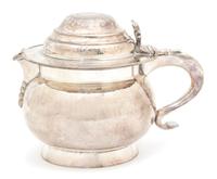 A Irish Silver Plate Hand Hammered Pitcher, 19TH CENTURY, the lid inset with an Irish coin, with an engraved armorial on the body.