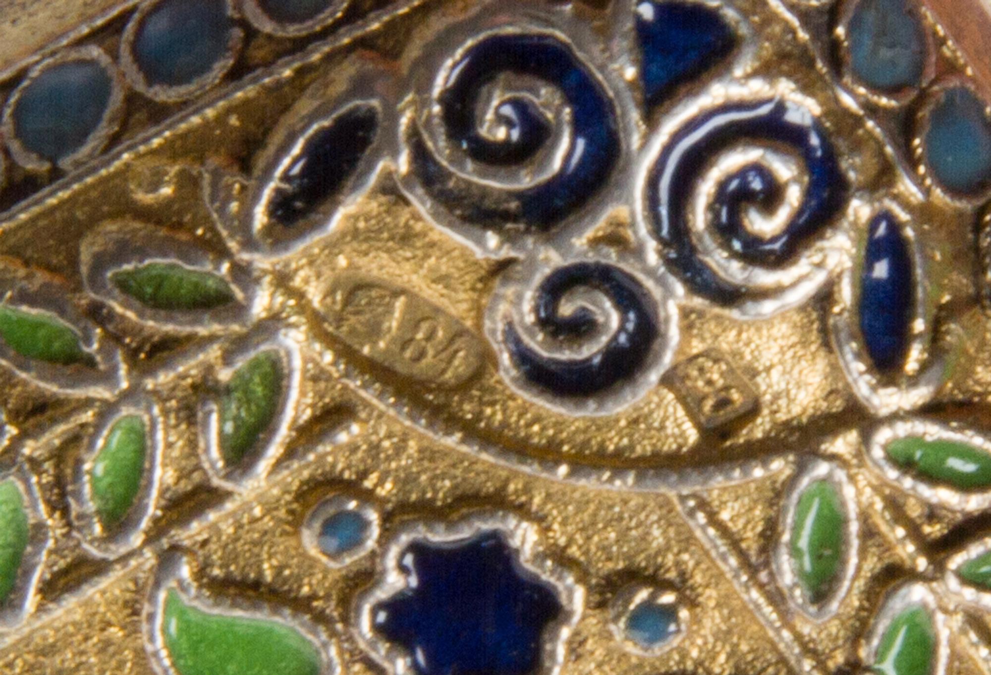 A Russian Silver and Enamel Cigarette Case, Maker's Mark Cyrillic SF, Moscow, the case having a matte gilt ground with foliate and geom