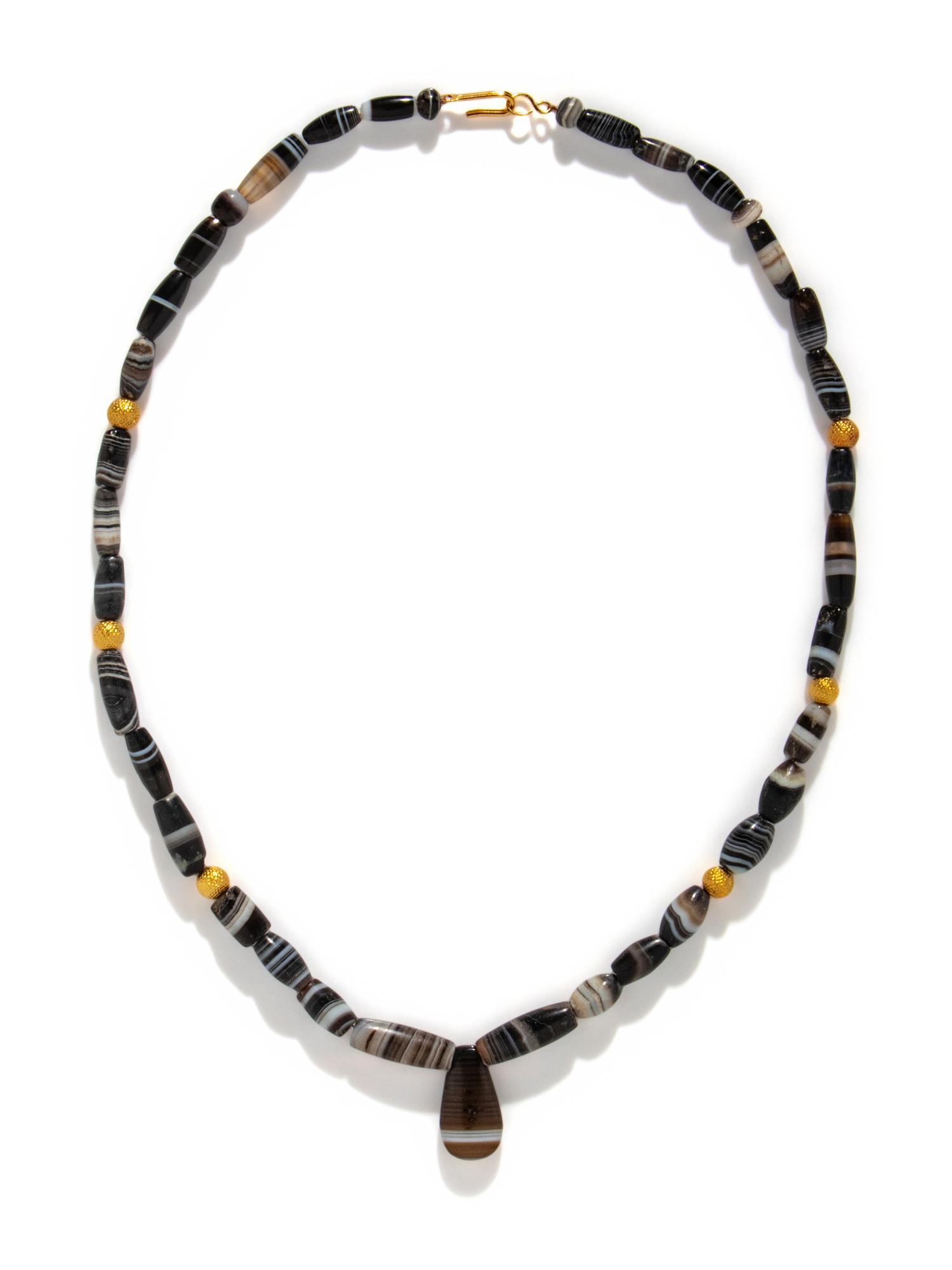 A Western Asiatic Banded Agate and Gold Bead Necklace