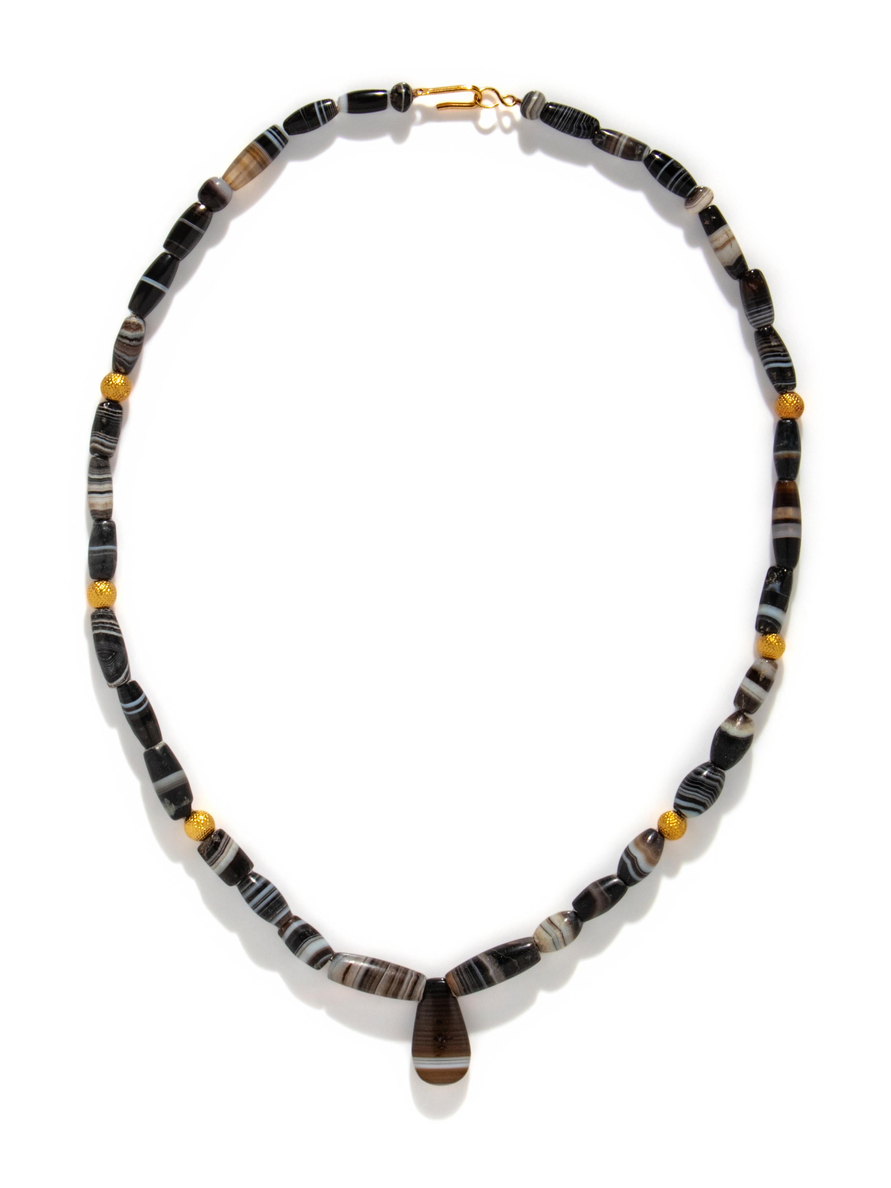 A Western Asiatic Banded Agate and Gold Bead Necklace