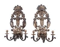 A Pair of Baroque Style Silvered Metal Three-Light Sconces