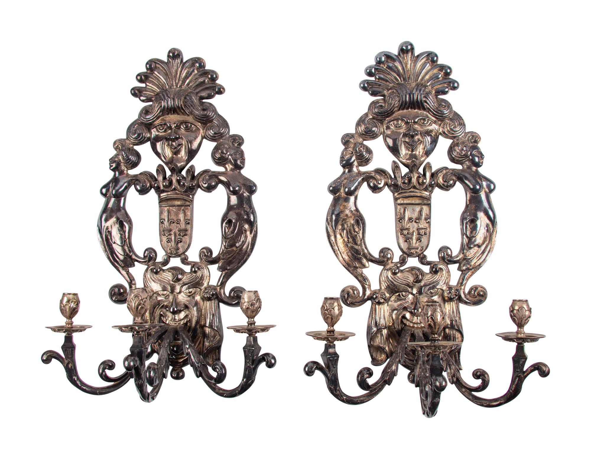 A Pair of Baroque Style Silvered Metal Three-Light Sconces