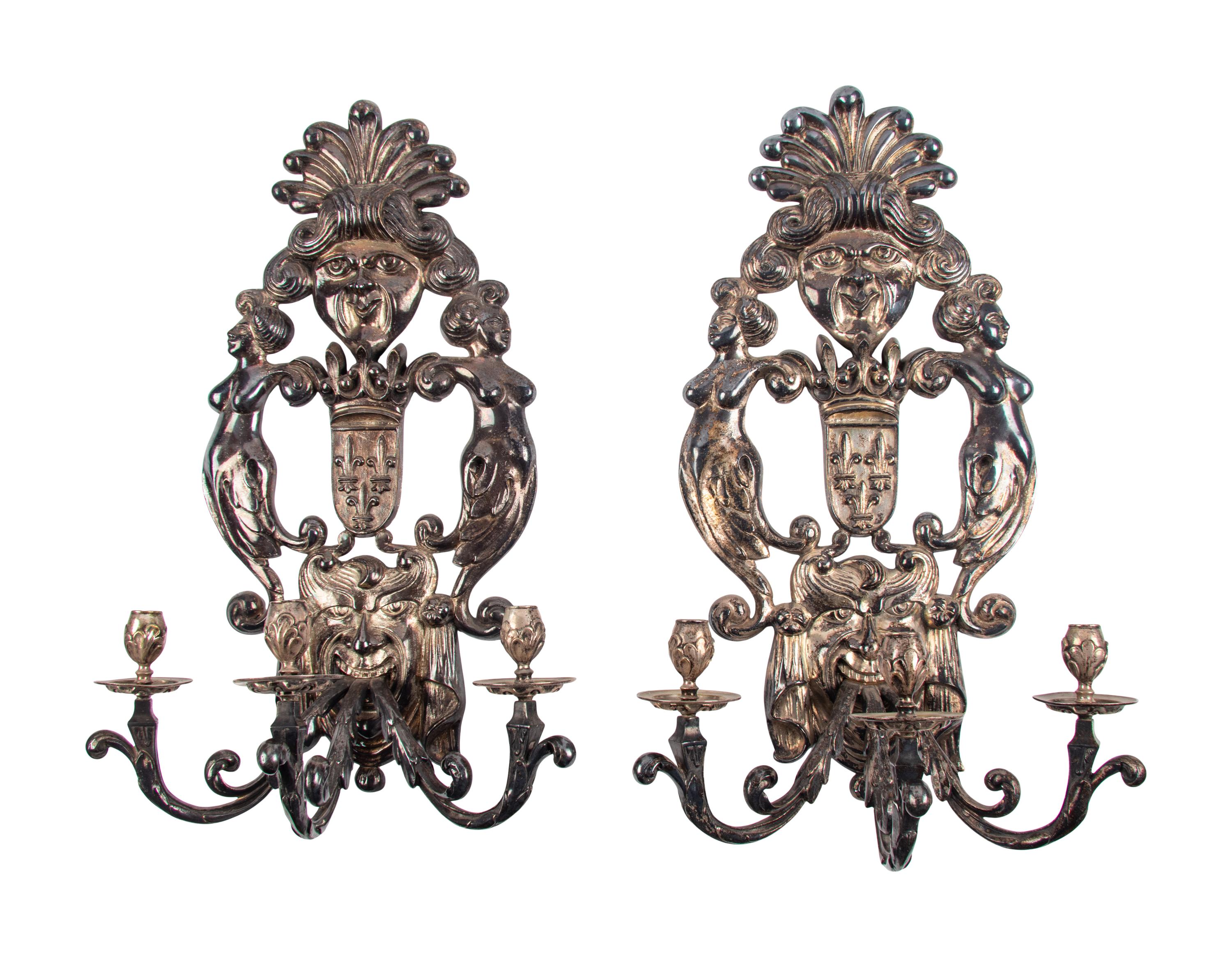 A Pair of Baroque Style Silvered Metal Three-Light Sconces