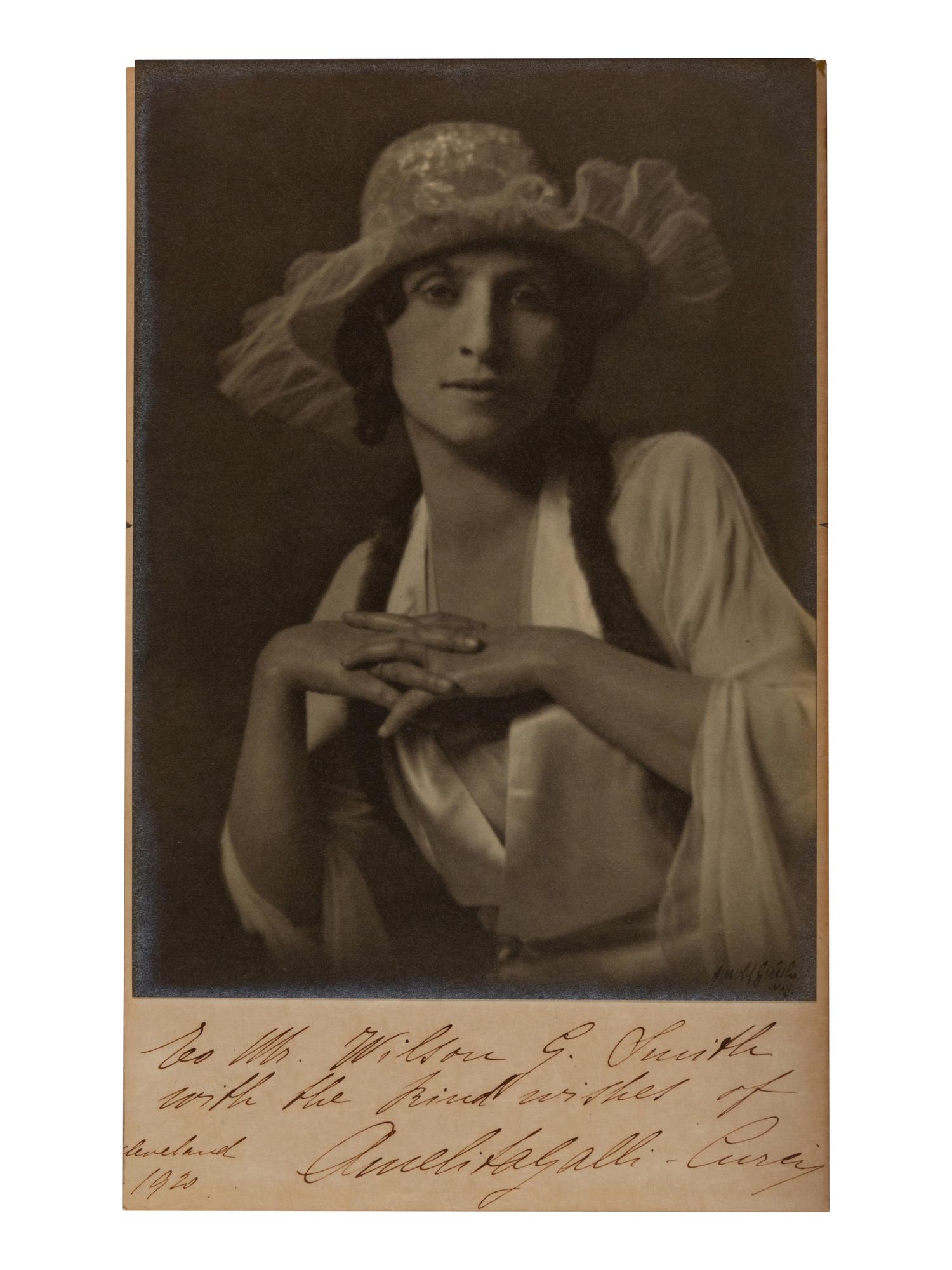 [20TH-CENTURY OPERA SINGERS]. A group of 7 photographs or photographic postcards of opera singers from the 1920s, most signed and inscribed, comprising images of: