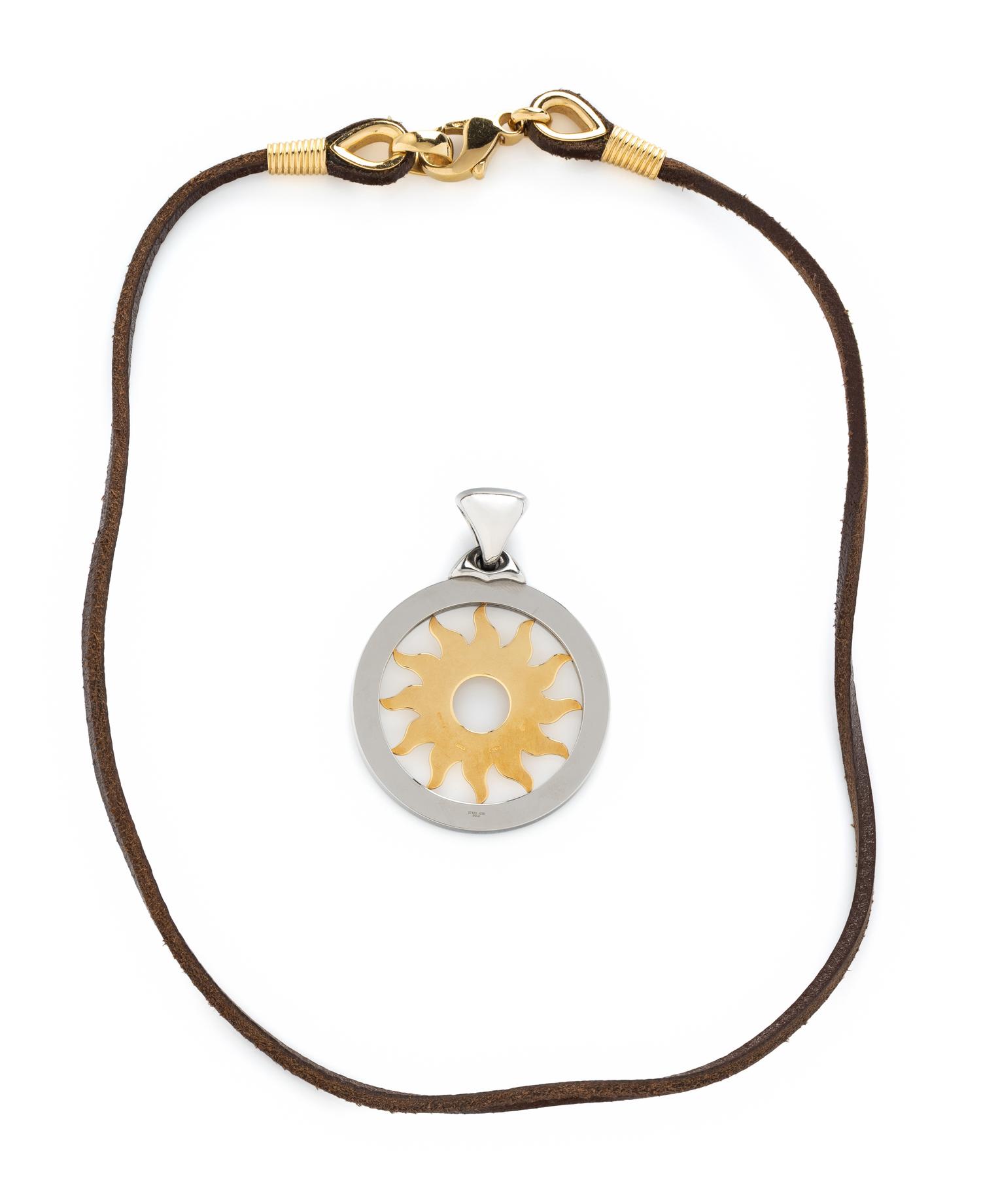 BULGARI, YELLOW GOLD AND STEEL SUN PENDANT AND BROWN LEATHER CORD