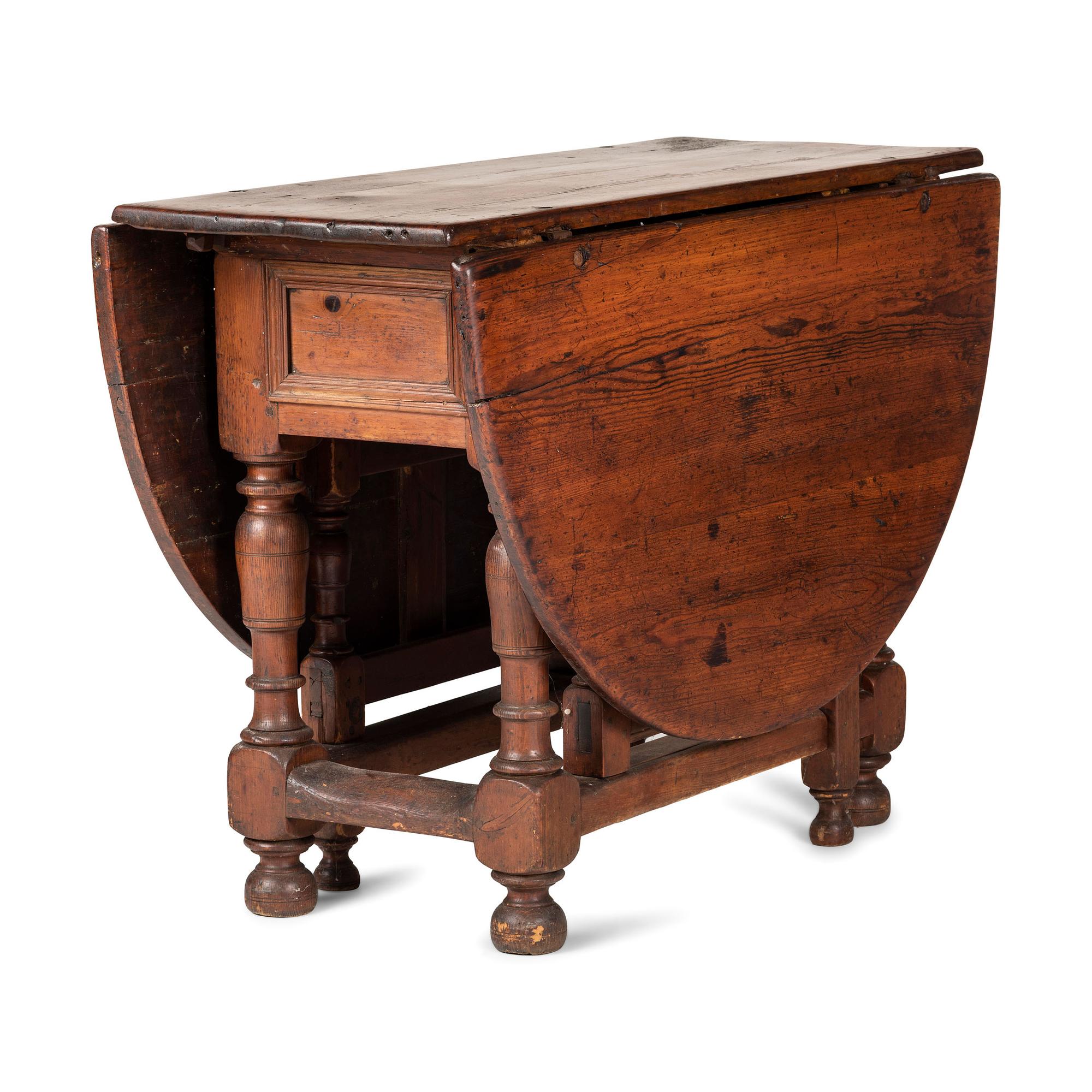A Swedish Turned and Block Carved Pine Drop-Leaf Gate-Leg Dining Table
