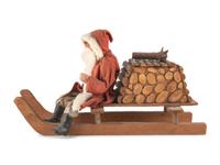A Papier-Mâché Santa Claus on Log Sleigh