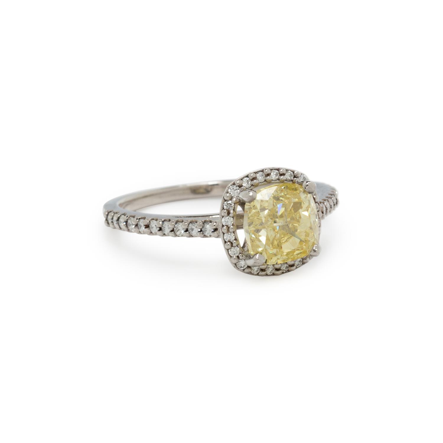 FANCY INTENSE YELLOW DIAMOND AND DIAMOND RING
